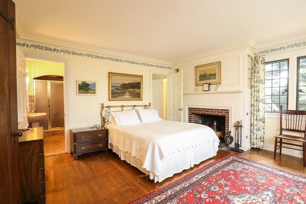 17 Longview Road Reading, MA 01867 - Photo 23 of 42 a spacious bedroom with a bed and a couch