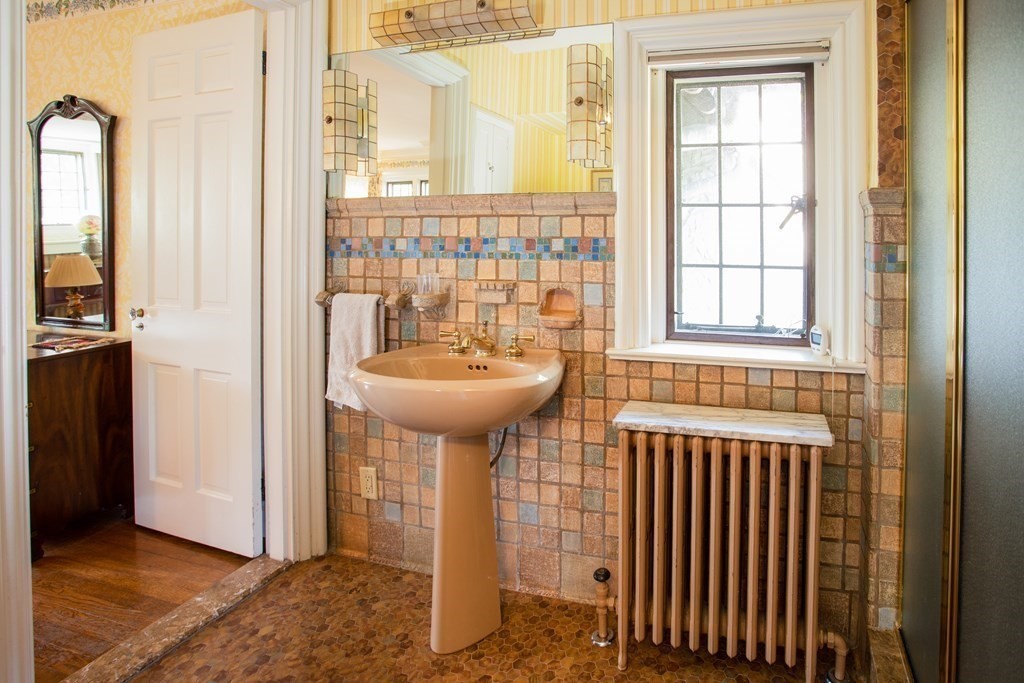 17 Longview Road Reading, MA 01867 - Photo 24 of 42 a bathroom with a sink and a mirror