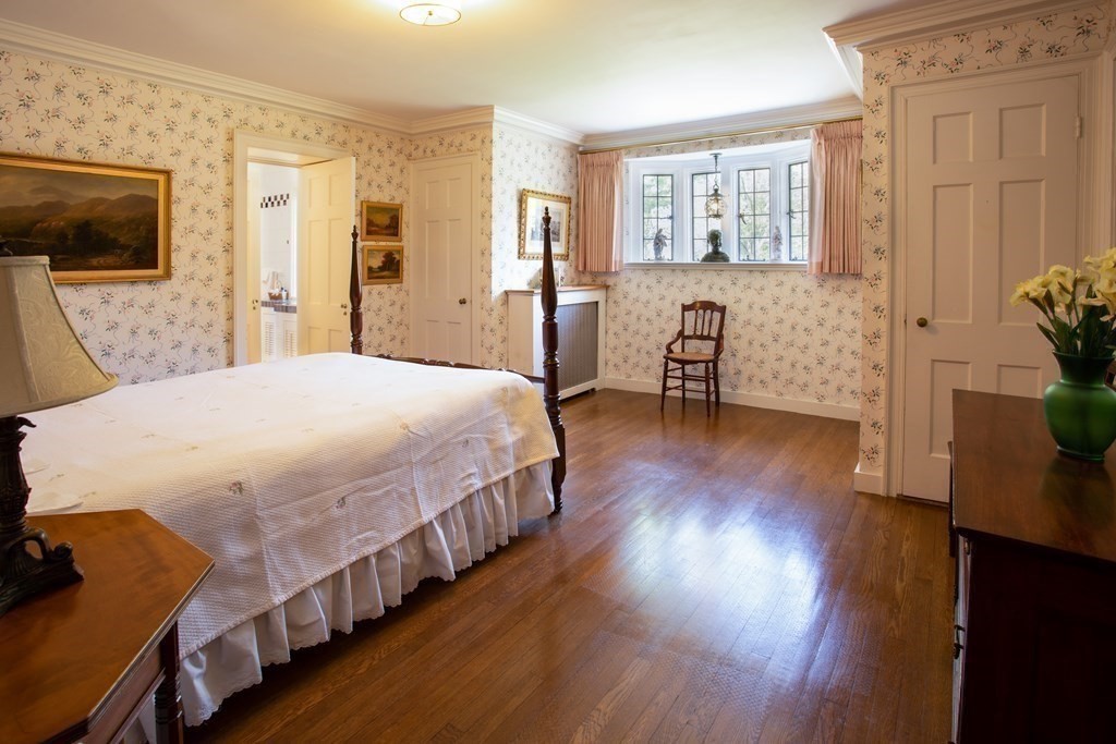 17 Longview Road Reading, MA 01867 - Photo 29 of 42 a spacious bedroom with a bed and wooden floor