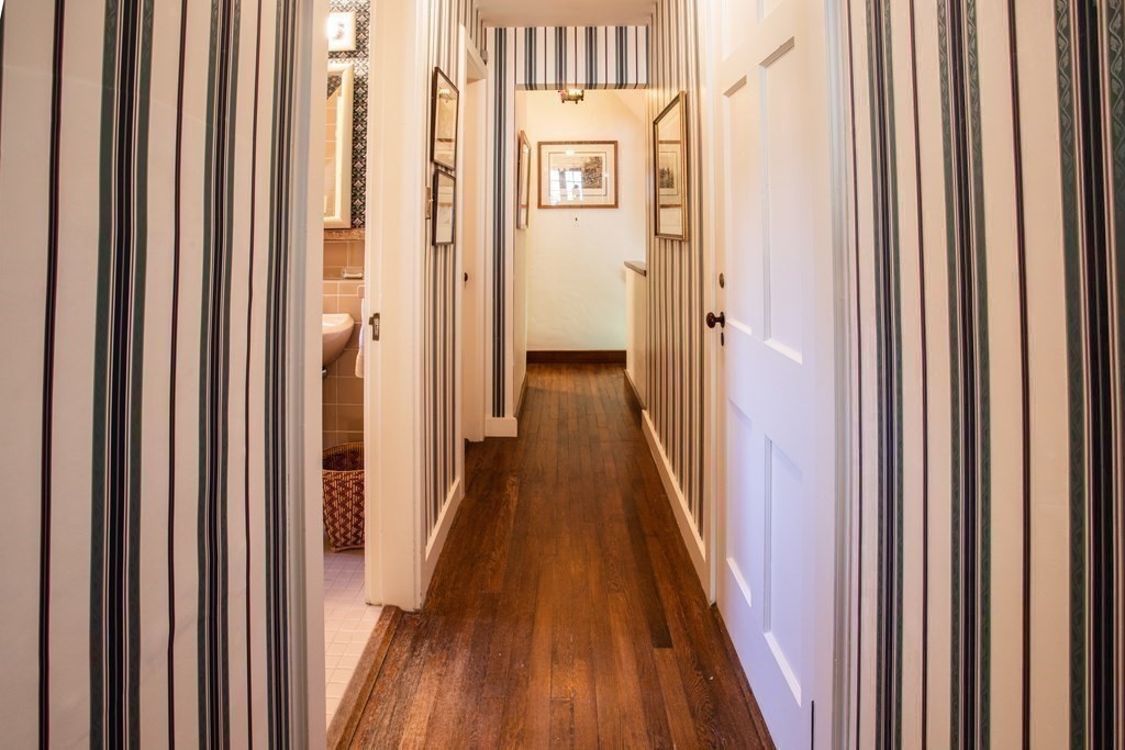 17 Longview Road Reading, MA 01867 - Photo 31 of 42 a view of a hallway with wooden floor and furniture