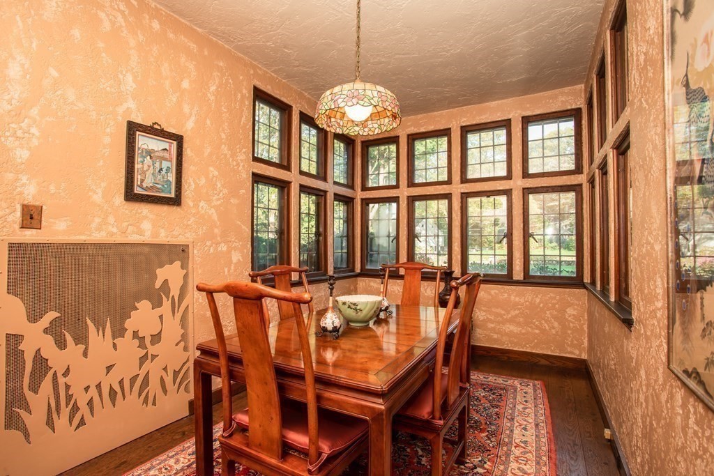 17 Longview Road Reading, MA 01867 - Photo 9 of 42 a dining room with wooden floor and large windows