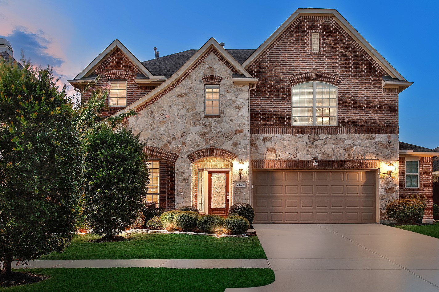a front view of a house with garden