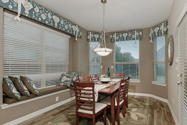 a view of a dining room with furniture window and outside view