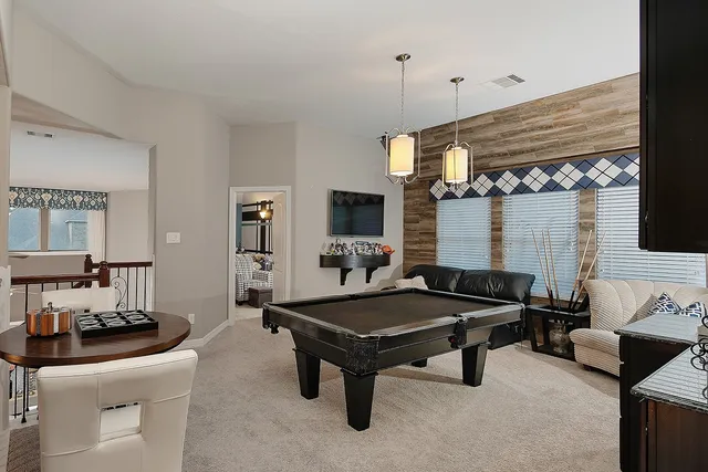 a room with furniture and flat screen tv