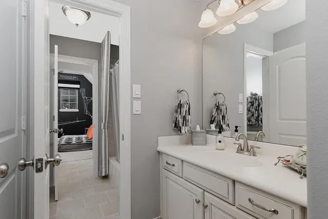 a bedroom with bed and a walk in closet