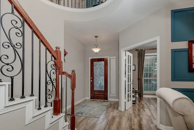 a view of an entryway with wooden floor