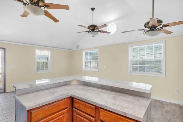 a view of a kitchen with a sink cabinets and window
