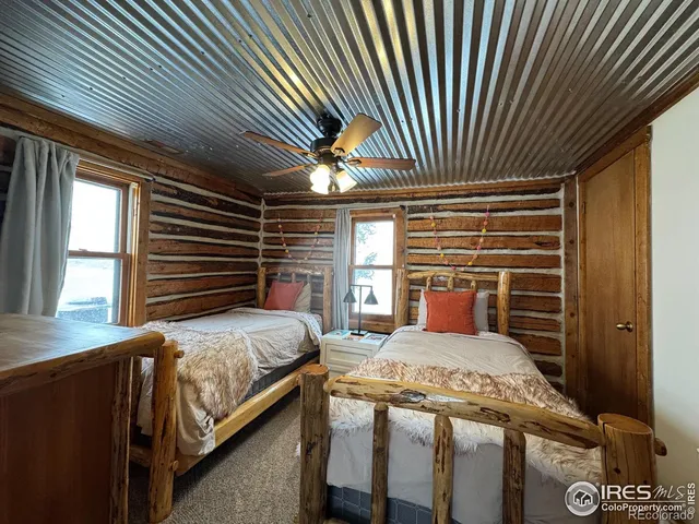 a bedroom with bed and balcony