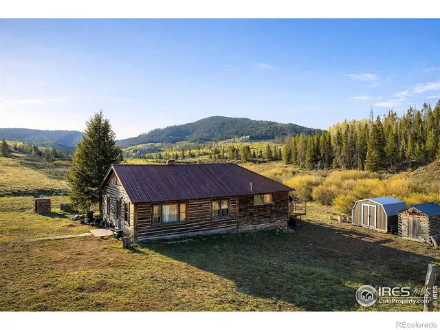 a view of residential houses with outdoor space and river