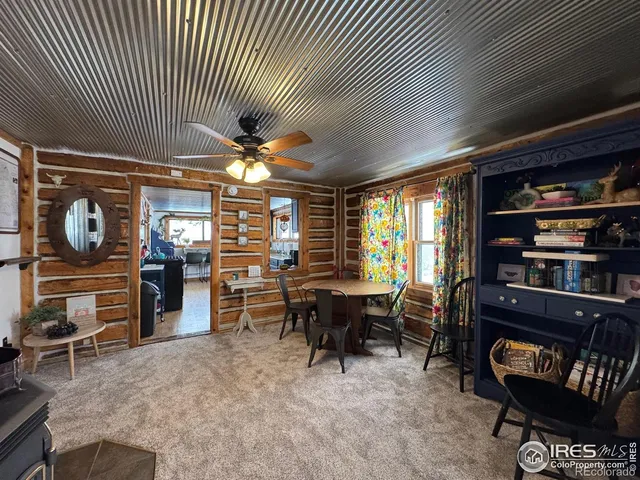 a view of a livingroom with furniture and window