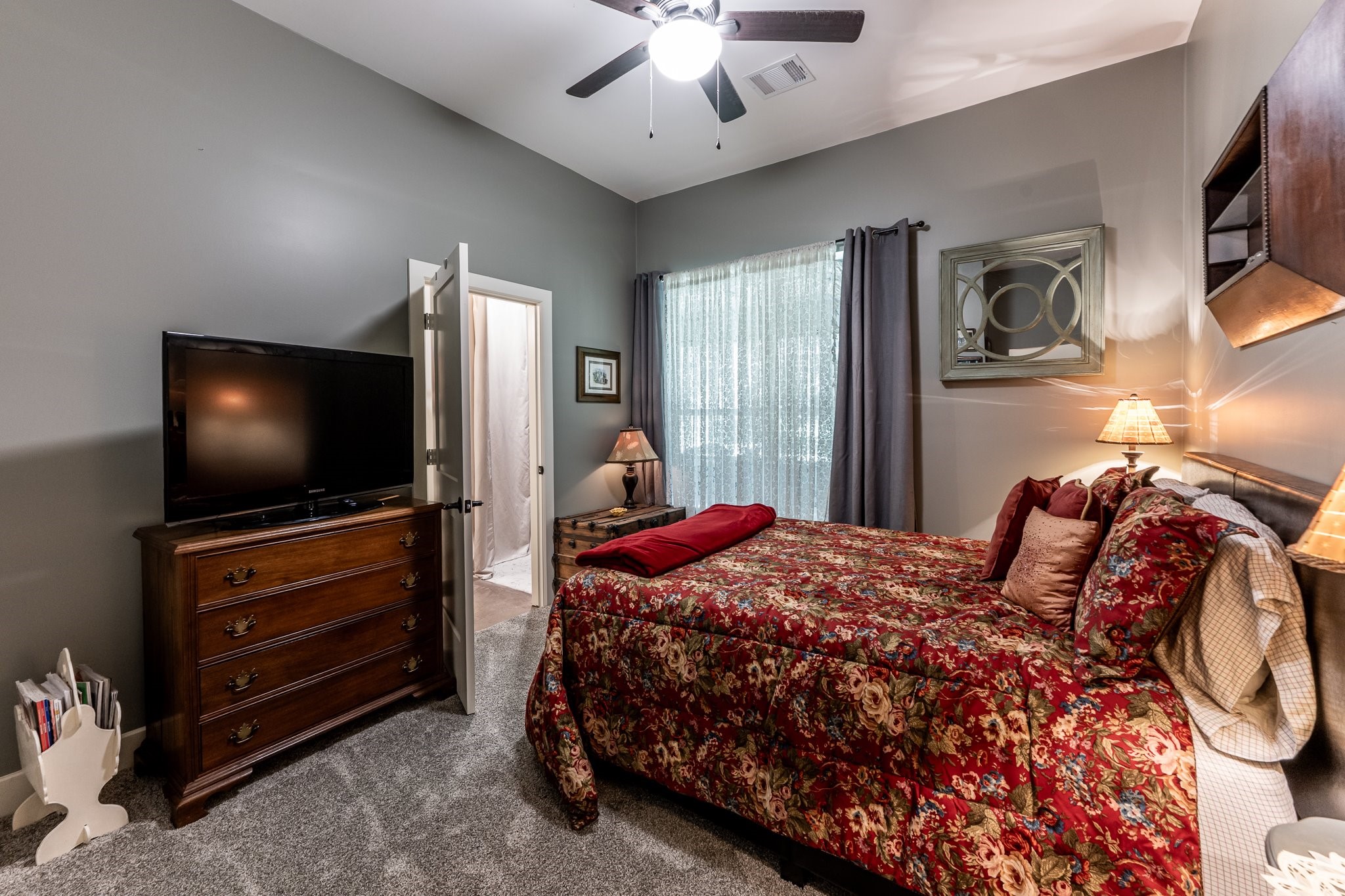 13334 Fultz Road Conroe, TX 77304 - Photo 24 of 49 This private secondary suite offers guests comfort and convenience with plush carpeting, natural light, and a full ensuite bath.