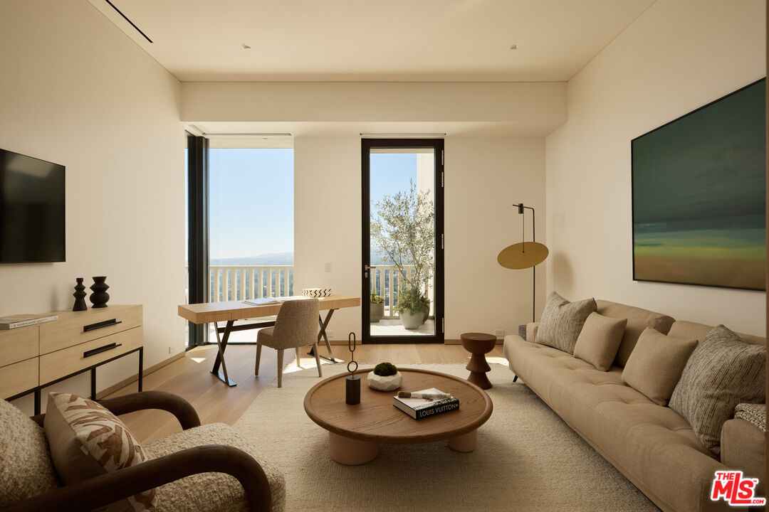 9255 Doheny Road, Unit PH West Hollywood, CA 90069 - Photo 21 of 24 a living room with furniture and a flat screen tv