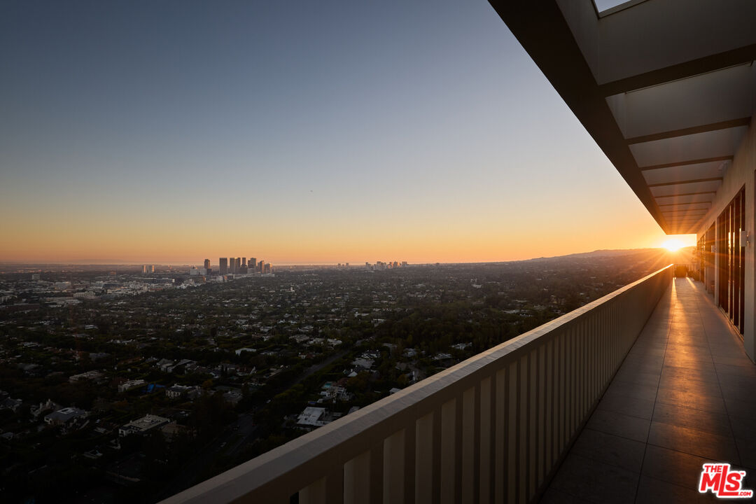 9255 Doheny Road, Unit PH West Hollywood, CA 90069 - Photo 24 of 24 a view of city and mountain from a balcony