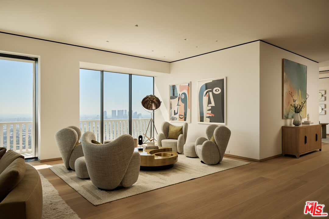 9255 Doheny Road, Unit PH West Hollywood, CA 90069 - Photo 4 of 24 a living room with furniture and a window