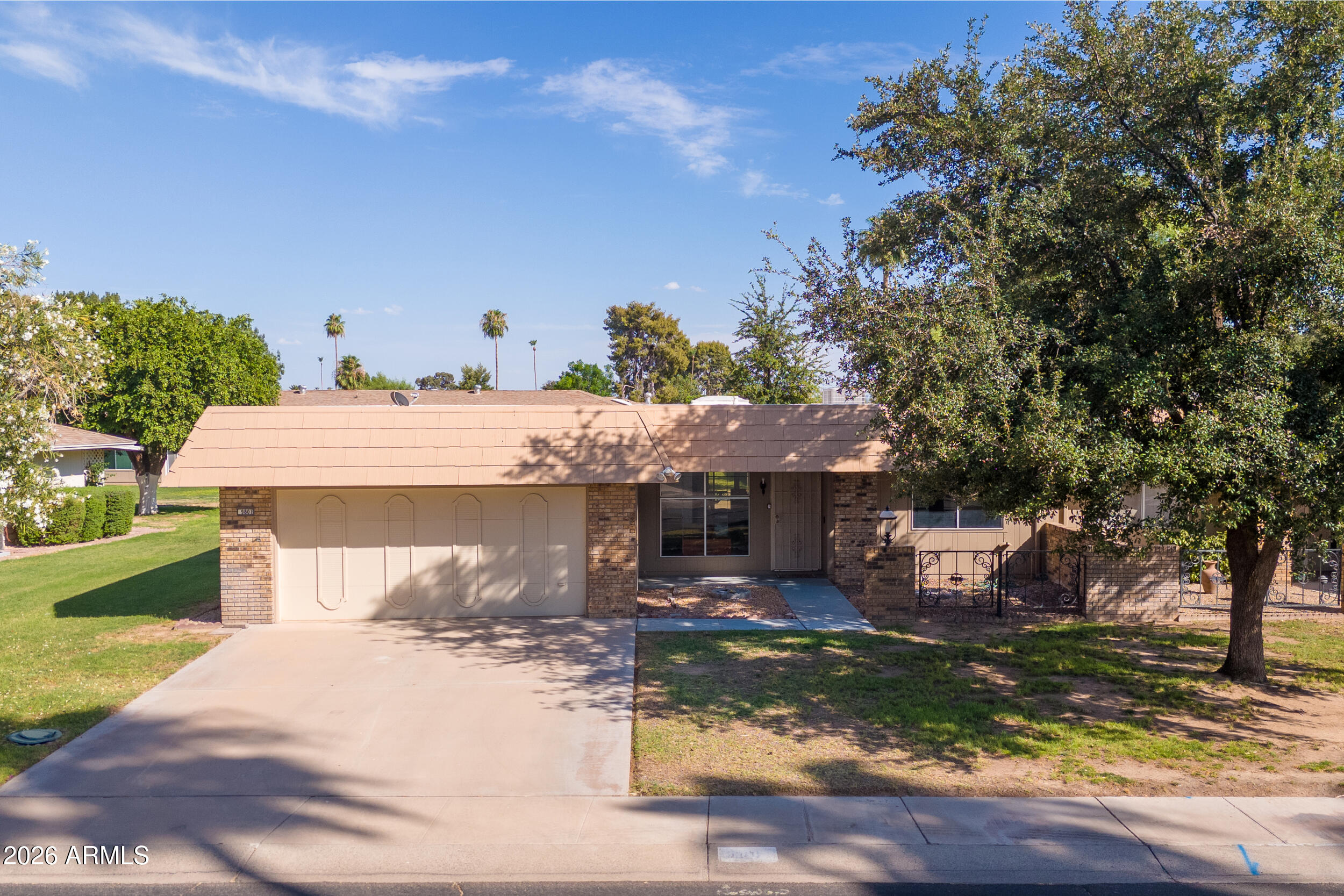 9801 West Pleasant Valley Road Sun City, AZ 85351 - Photo 1 of 26 a view of a house with pool and sitting area
