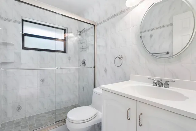 a backyard of a house with outdoor seating and yard