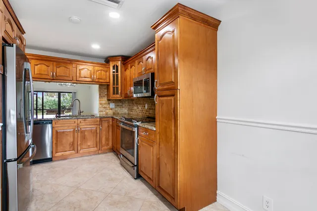 a kitchen with a stove and a microwave