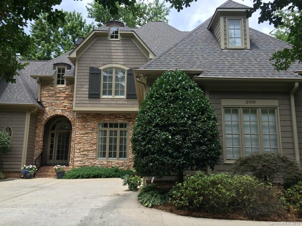 2138 Harris Road Charlotte, NC 28211 - Photo 1 of 17 a front view of a house with garden