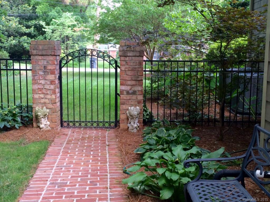 2138 Harris Road Charlotte, NC 28211 - Photo 12 of 17 a view of a garden with plants and large trees