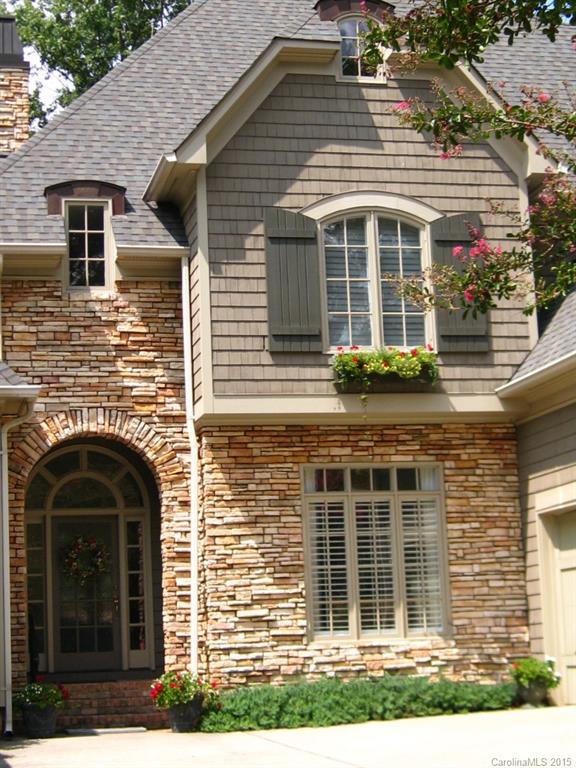 2138 Harris Road Charlotte, NC 28211 - Photo 13 of 17 a front view of a house with a yard