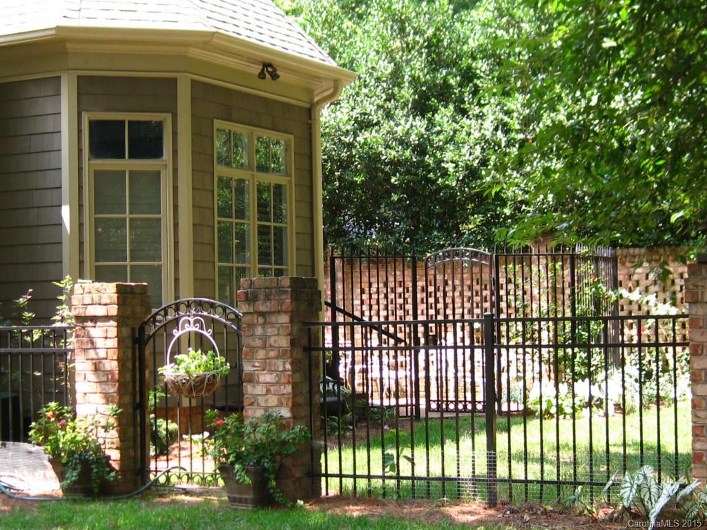 2138 Harris Road Charlotte, NC 28211 - Photo 14 of 17 a front view of a house with a garden