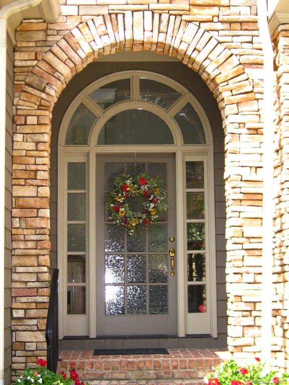 2138 Harris Road Charlotte, NC 28211 - Photo 15 of 17 a front view of a house with a porch