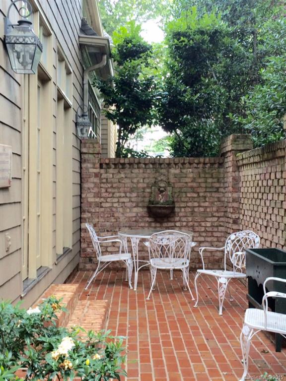 2138 Harris Road Charlotte, NC 28211 - Photo 17 of 17 a view of a patio with table and chairs and potted plants