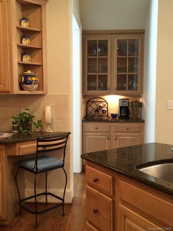 2138 Harris Road Charlotte, NC 28211 - Photo 6 of 17 a kitchen with granite countertop a sink and a stove