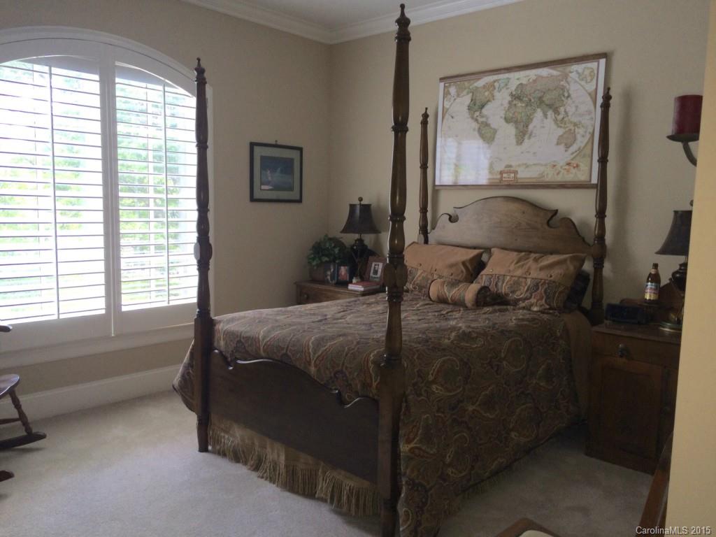 2138 Harris Road Charlotte, NC 28211 - Photo 8 of 17 a bedroom with a bed and a window