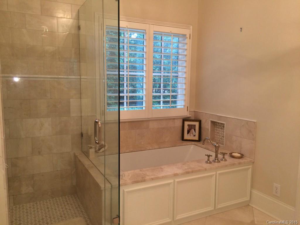 2138 Harris Road Charlotte, NC 28211 - Photo 9 of 17 a bathroom with a tub sink and shower