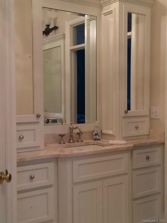 2138 Harris Road Charlotte, NC 28211 - Photo 10 of 17 a bathroom with a sink and a mirror