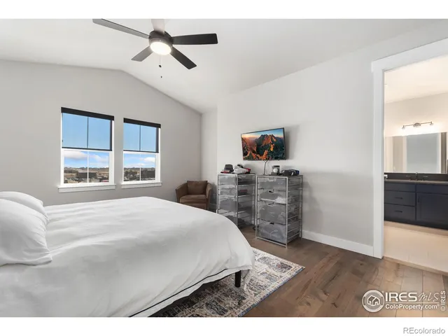 a bedroom with a bed dresser and a window