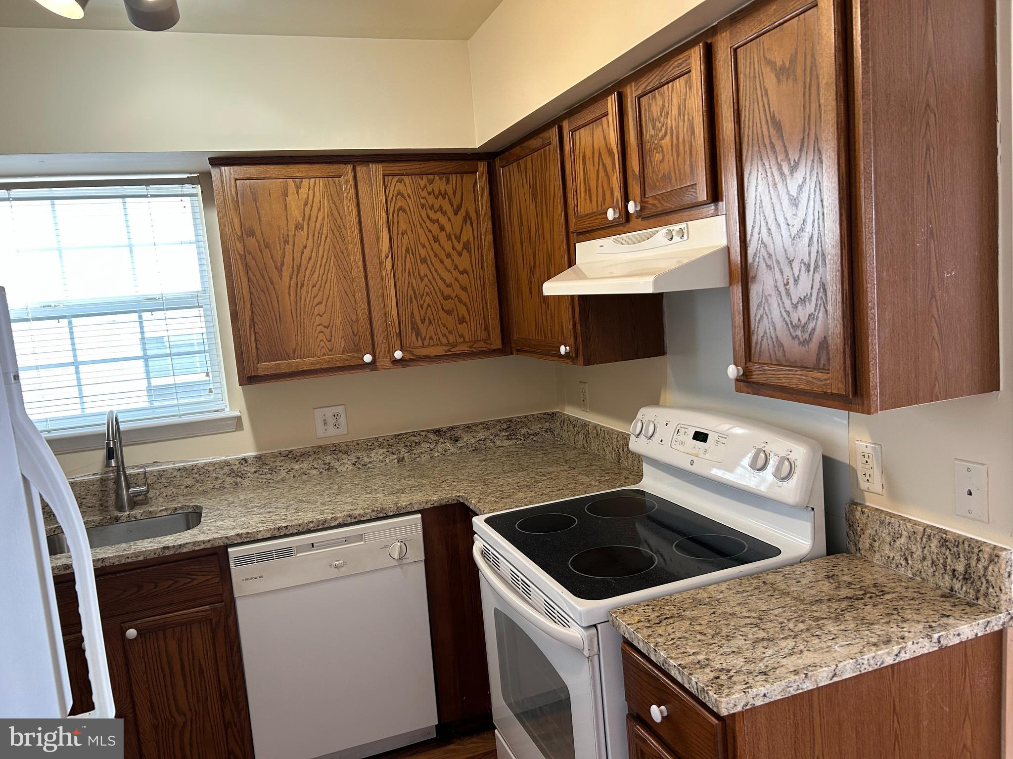 981 Main Avenue Hagerstown, MD 21740 - Photo 11 of 39 a kitchen that has a sink a stove and a window