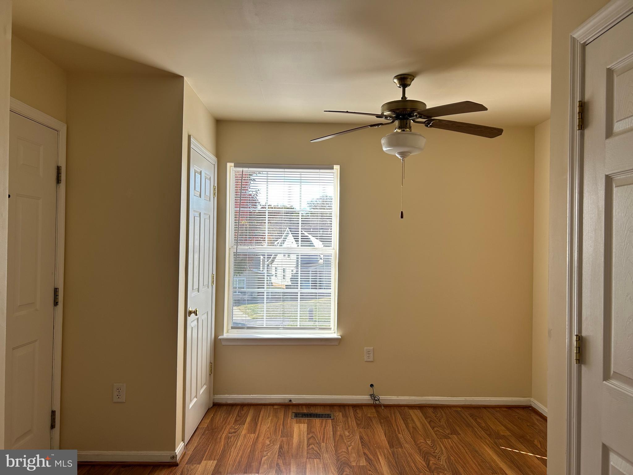 981 Main Avenue Hagerstown, MD 21740 - Photo 16 of 39 a view of a room with wooden floor a ceiling fan and windows