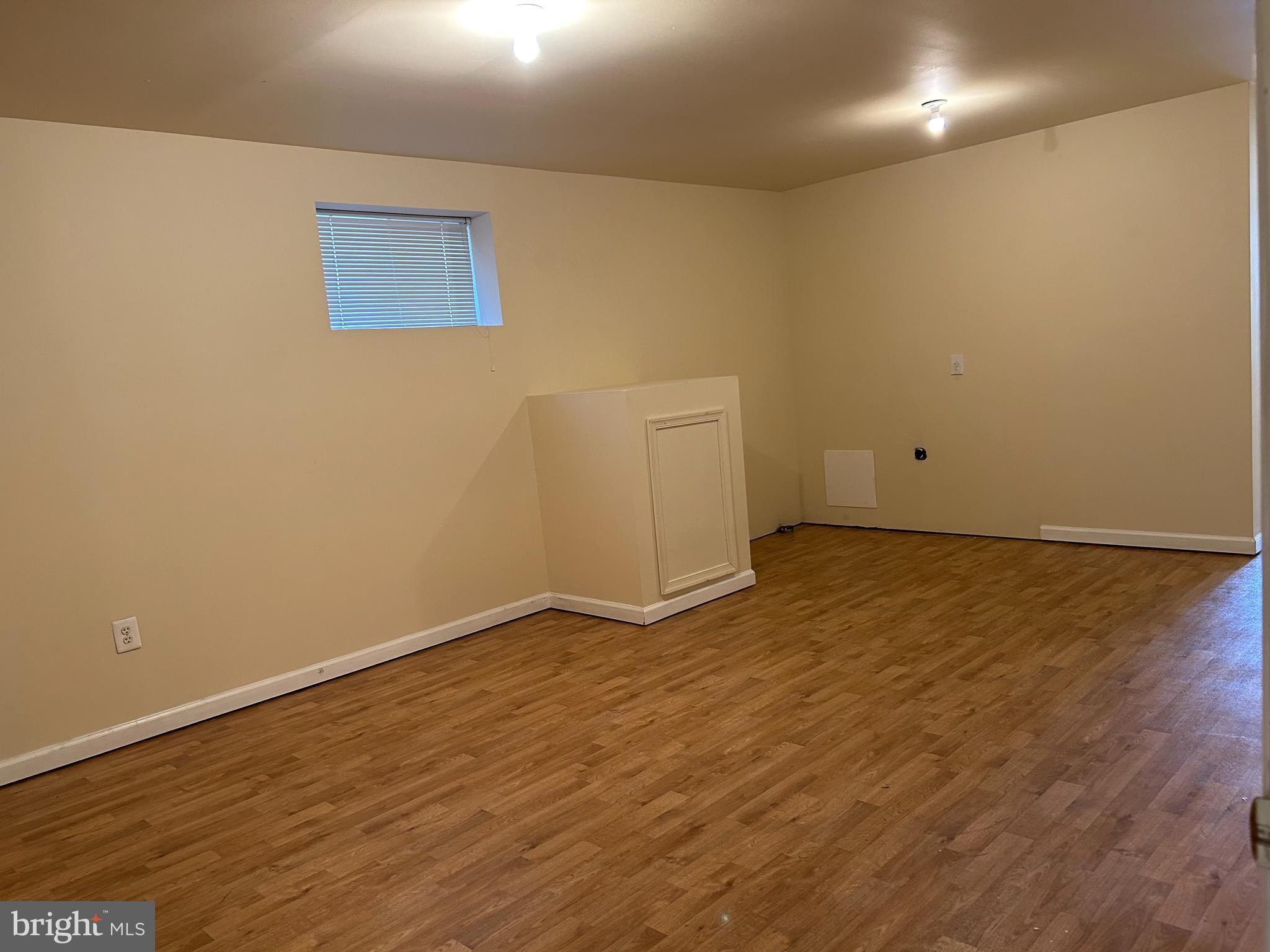 981 Main Avenue Hagerstown, MD 21740 - Photo 34 of 39 an empty room with wooden floor and white walls