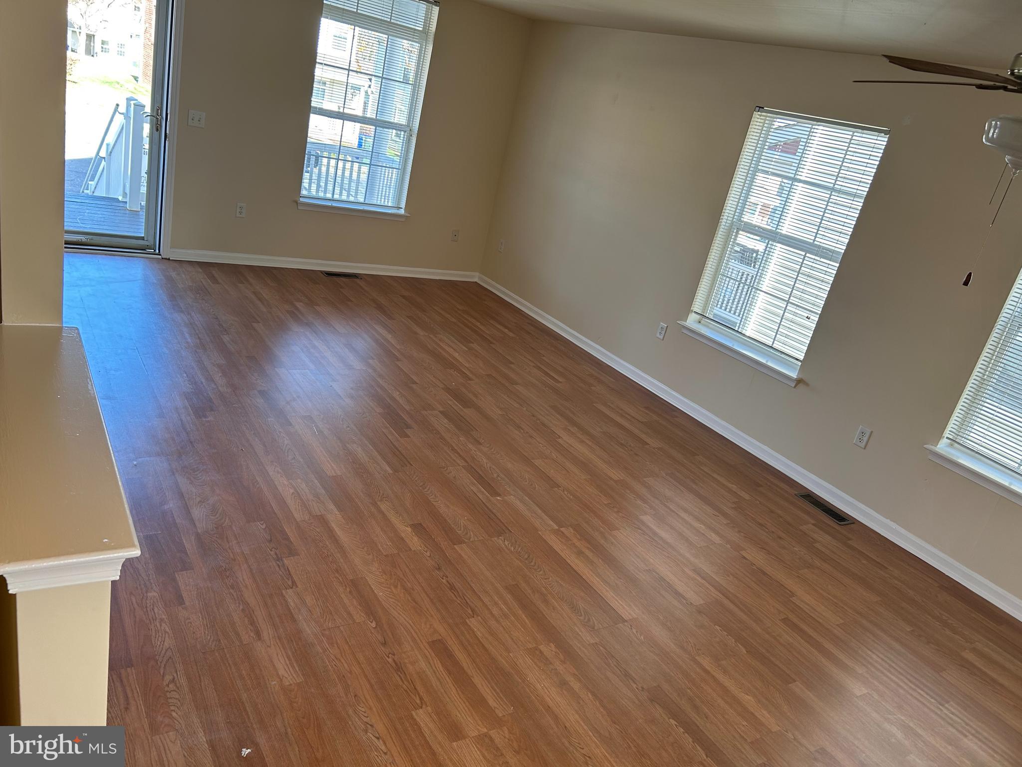 981 Main Avenue Hagerstown, MD 21740 - Photo 4 of 39 a view of an empty room with wooden floor and a window