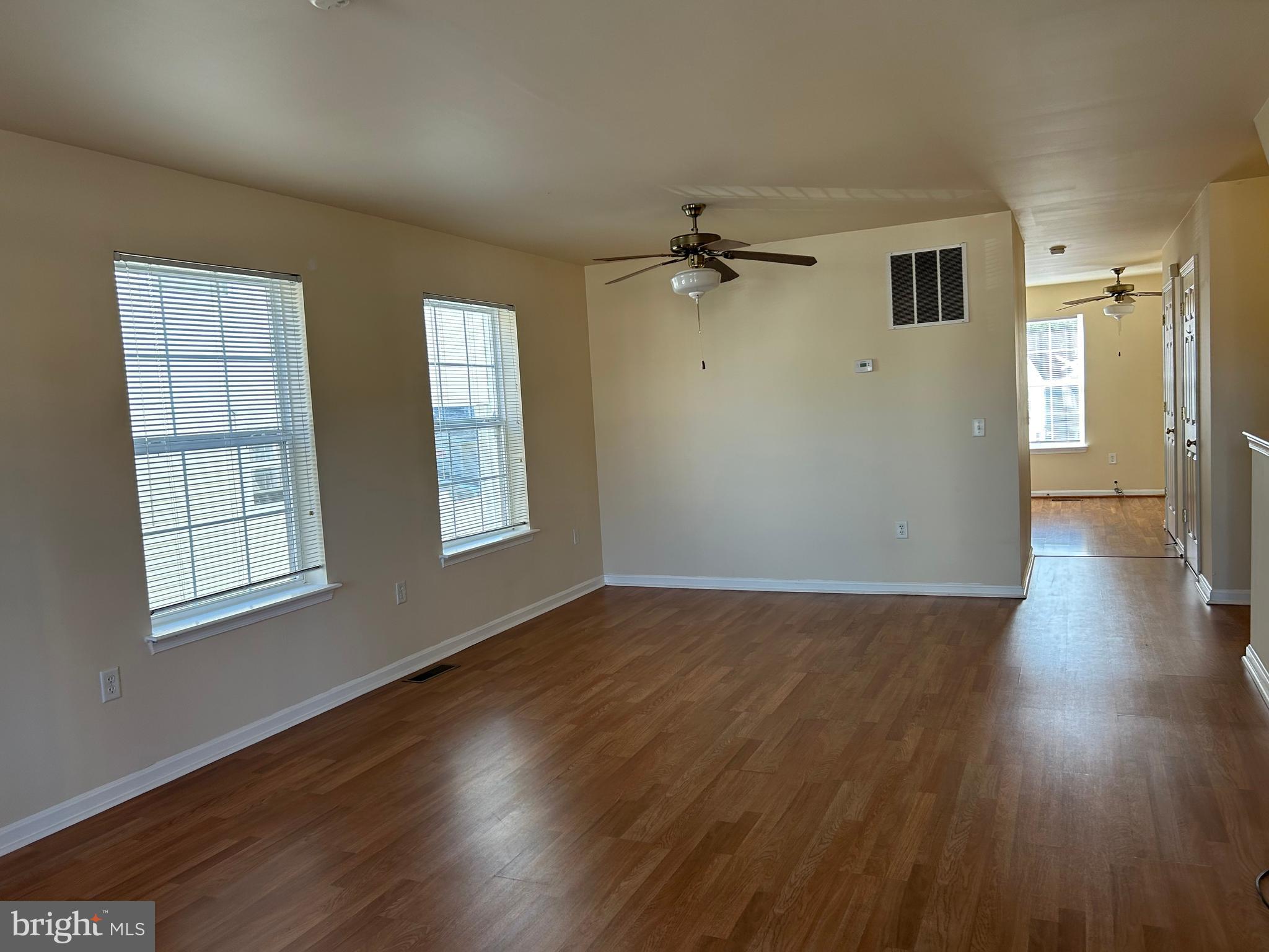 981 Main Avenue Hagerstown, MD 21740 - Photo 6 of 39 an empty room with wooden floor and windows
