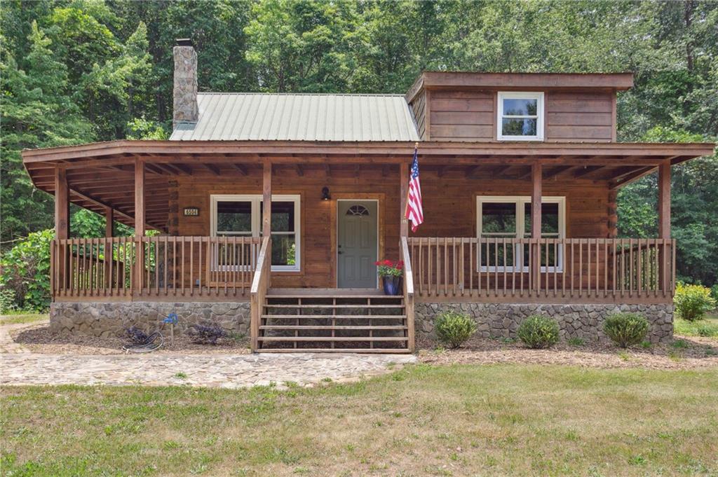 6504 Mt Vernon Road Clermont, GA 30527 - Photo 1 of 1 a front view of a house with a yard