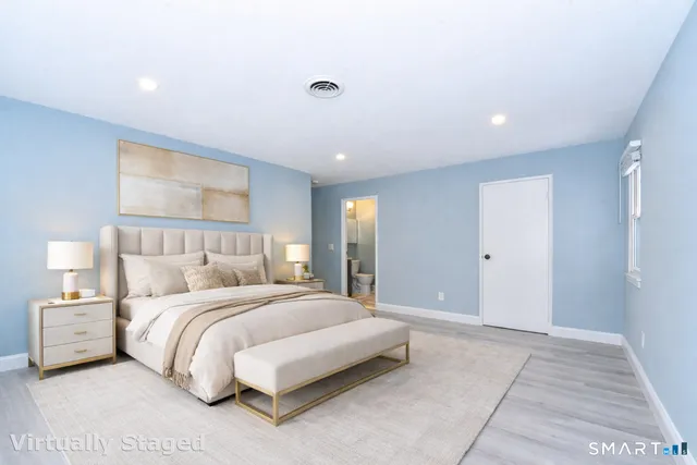 a kitchen with granite countertop a stove and a microwave
