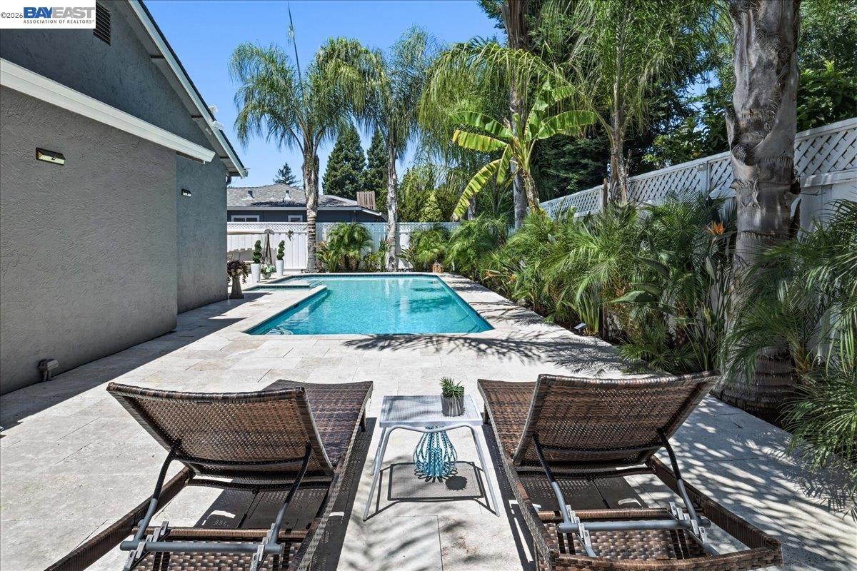2861 Millbridge Place San Ramon, CA 94583 - Photo 49 of 58 a patio with table and chairs with potted plants and large tree