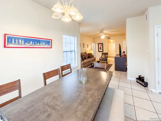 a view of a livingroom with furniture and a large window