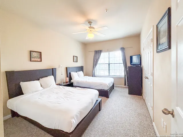 a bedroom with bed and window