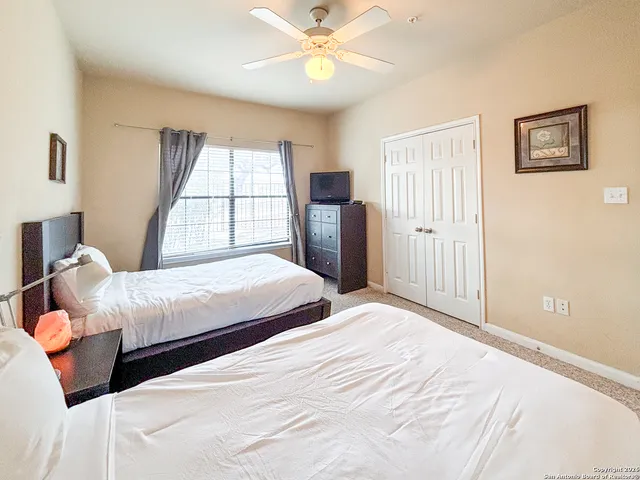 a bathroom with a sink a toilet and shower curtain