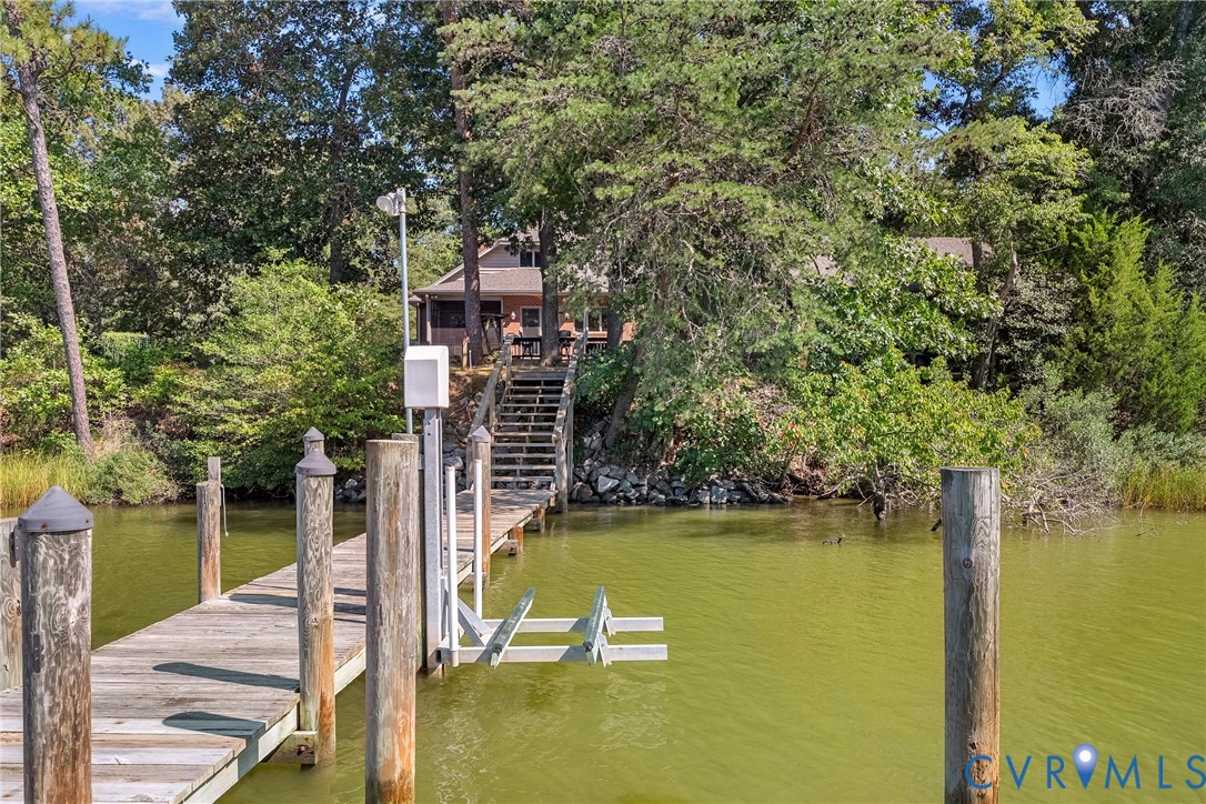 447 Tranquility Road Reedville, VA 22539 - Photo 78 of 82 Private wooden dock featuring a boat lift, leading