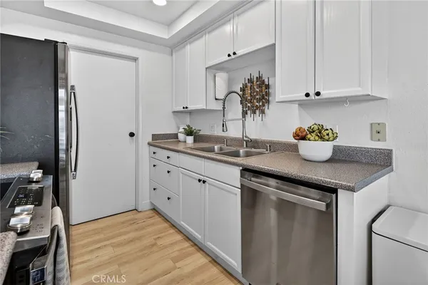 a kitchen with a sink and cabinets