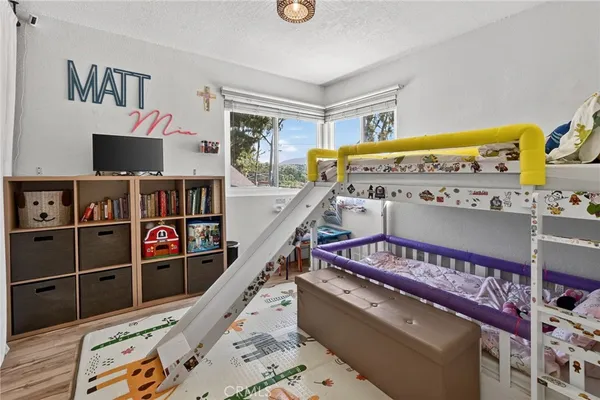 a living room with lots of furniture and a flat screen tv