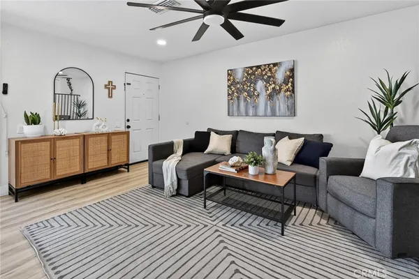 a living room with furniture and window