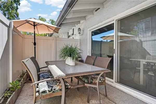 a patio with table and chairs