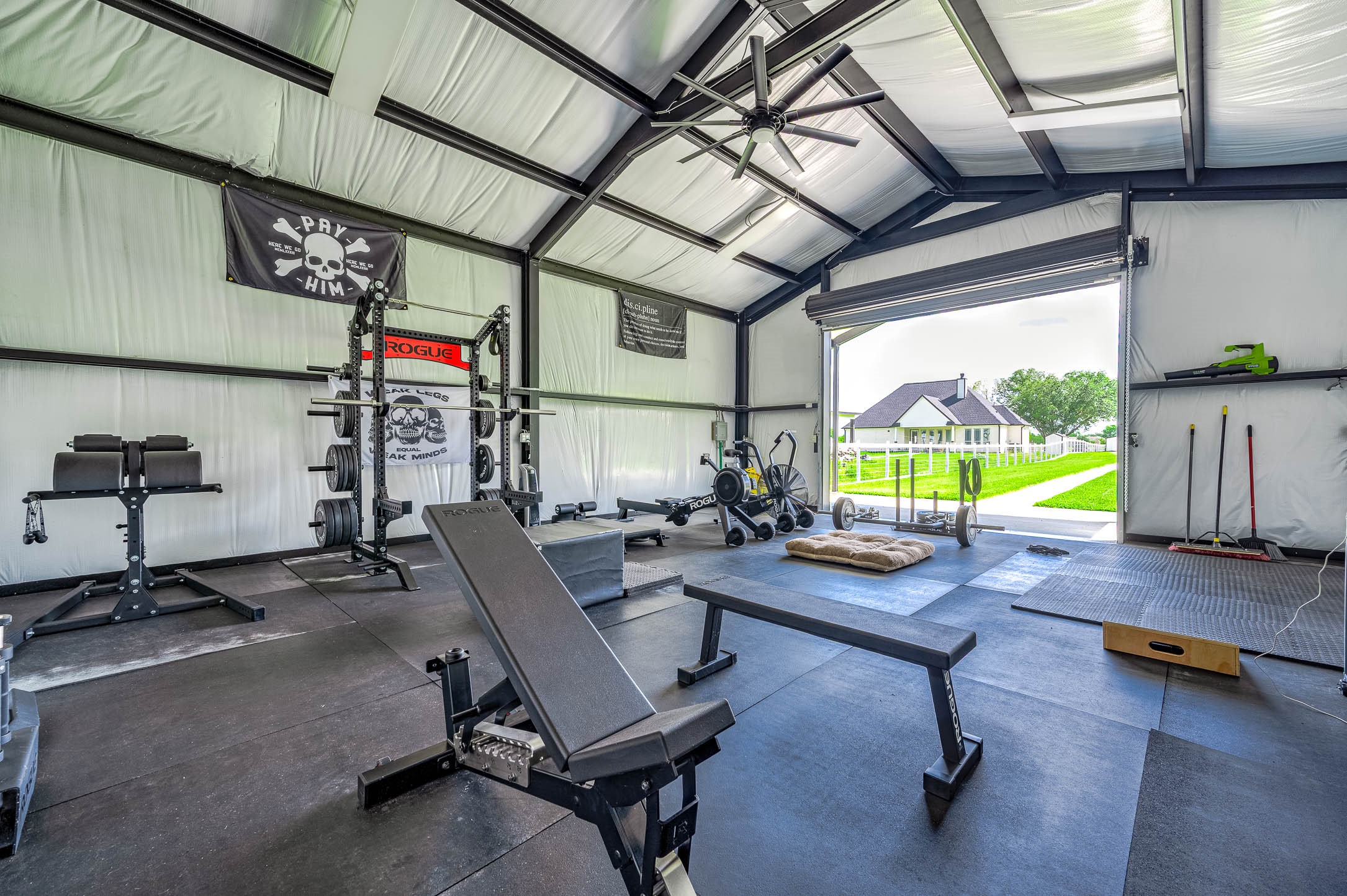 8032 Short Road Needville, TX 77461 - Photo 37 of 50 This spacious outbuilding offers an open and functional layout with high ceilings, abundant natural light, and views overlooking the backyard. The versatile space is ideal for a home gym, workshop, recreational area, or additional storage.