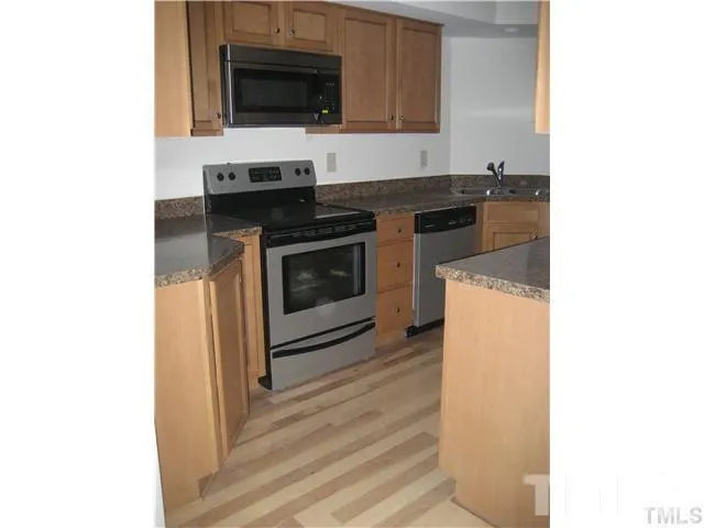 a kitchen with a stove and a microwave